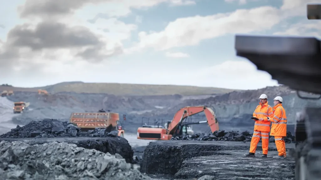 miners and crane at mining camp