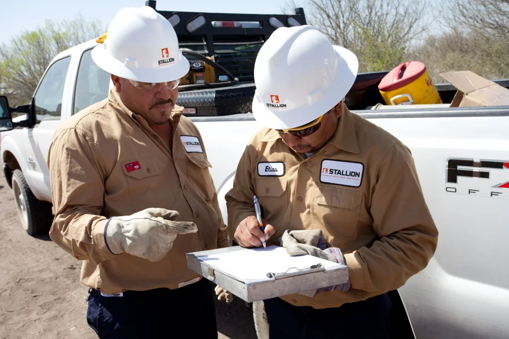 stallion employees checking clipboard