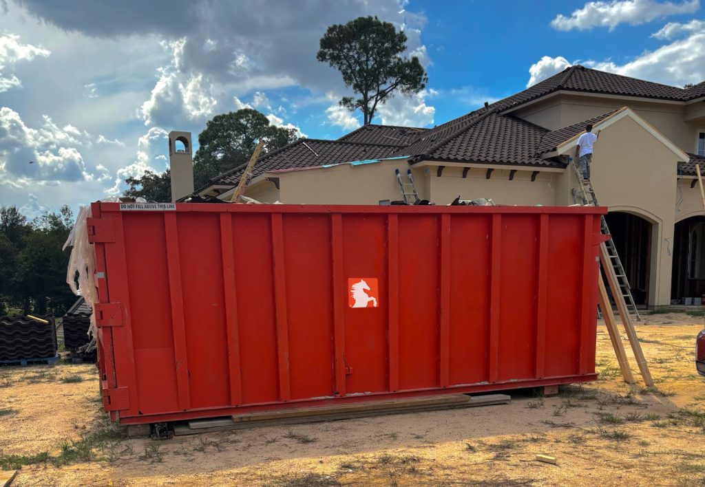 Stallion dumpster on job site